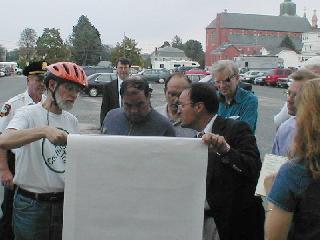 Discussing
                  commuter-rail parking garage. [Click to enlarge.]