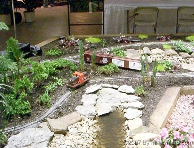 070323FlowerShow629 One garden came complete with electric trains.