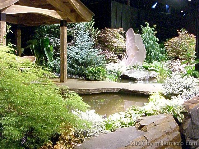 070323FlowerShow637 ..a larger pond feature in a garden.