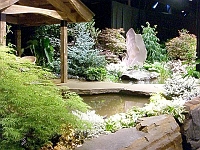 070323FlowerShow637 ..a larger pond feature in a garden.