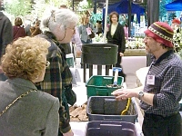 070323FlowerShow733 Jill and The Worm Guy exchange composting tips.